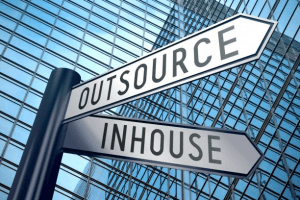 Image of a street sign reading Outsource and Inhouse